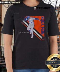 Juan Soto posing confidently in a Queens Superstar tee, showcasing style and passion for baseball. Perfect for fans!