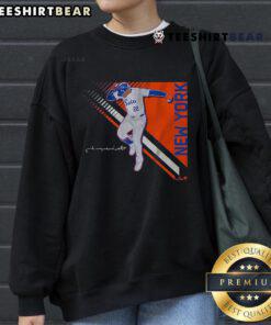 Juan Soto posing confidently in a stylish Queens Superstar 2.0 sweatshirt, showcasing his unique fashion sense and personality.