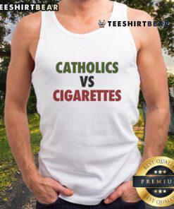 Ryan Cotter wearing a 'Catholics Vs Cigarettes' tank top, showcasing a bold design perfect for casual summer wear.