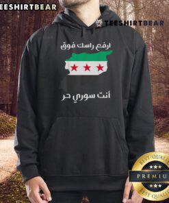 Proud Syrian people wearing 'Syria is Free' hoodie, celebrating freedom and unity in Syria.