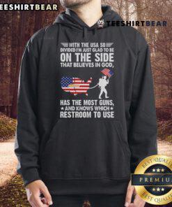 Person wearing 'Nice With The USA So Divide' hoodie, showcasing faith in God and patriotic pride, ideal for believers.