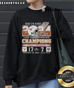 Alt Text: Official Hook 'Em Horns 2024 Lone Star Showdown Champions Texas 17-7 sweatshirt featuring bold team logo.