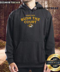 Official Mizzou Basketball Coach wearing 'Rush The Court' hoodie during game, showcasing team spirit and excitement.