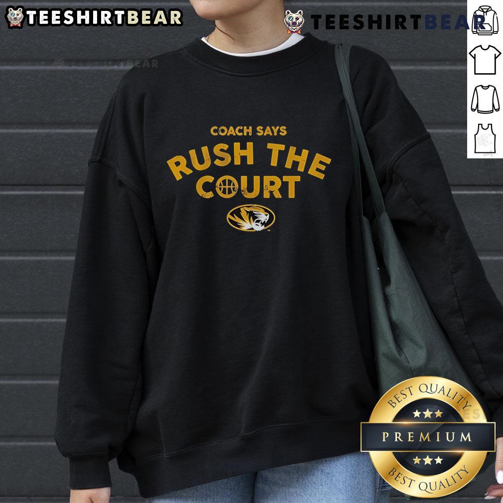 Official Mizzou Basketball Coach wearing 'Rush The Court' sweatshirt during a game, showcasing team spirit and pride.