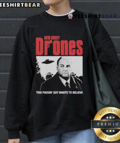 Official New Jersey Drones sweatshirt featuring 'This Fckin Guy Wants To Believe' design in bold letters.