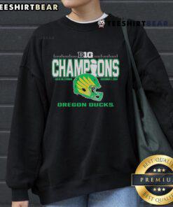 Alt Text: Oregon Ducks 2024 Big Ten Football Conference Champions sweatshirt displayed in a locker room setting.
