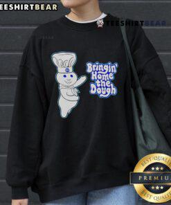 Alt Text: Official Pillsbury Doughboy Bringing Home The Dough 2024 Sweatshirt featuring iconic mascot in a cozy design.