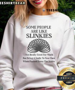 Official Some People Are Like Slinkies Sweatshirt featuring a humorous quote and cozy design for casual wear.