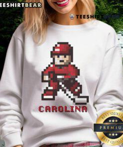 Premium Carolina Hurricanes hockey team 8-bit sweatshirt featuring retro design and vibrant team colors.