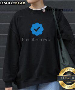 Premium 'I Am The Media' sweatshirt featuring a social media verified check mark badge design.