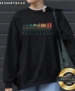 Retro gaming sweatshirt featuring video game controller evolution from the 80s and 90s, perfect for gamers.