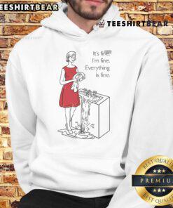 Alt Text: Woman wearing 'Top Cookie Theft Mom Everything Is Fine' hoodie, smiling in a cozy kitchen setting.