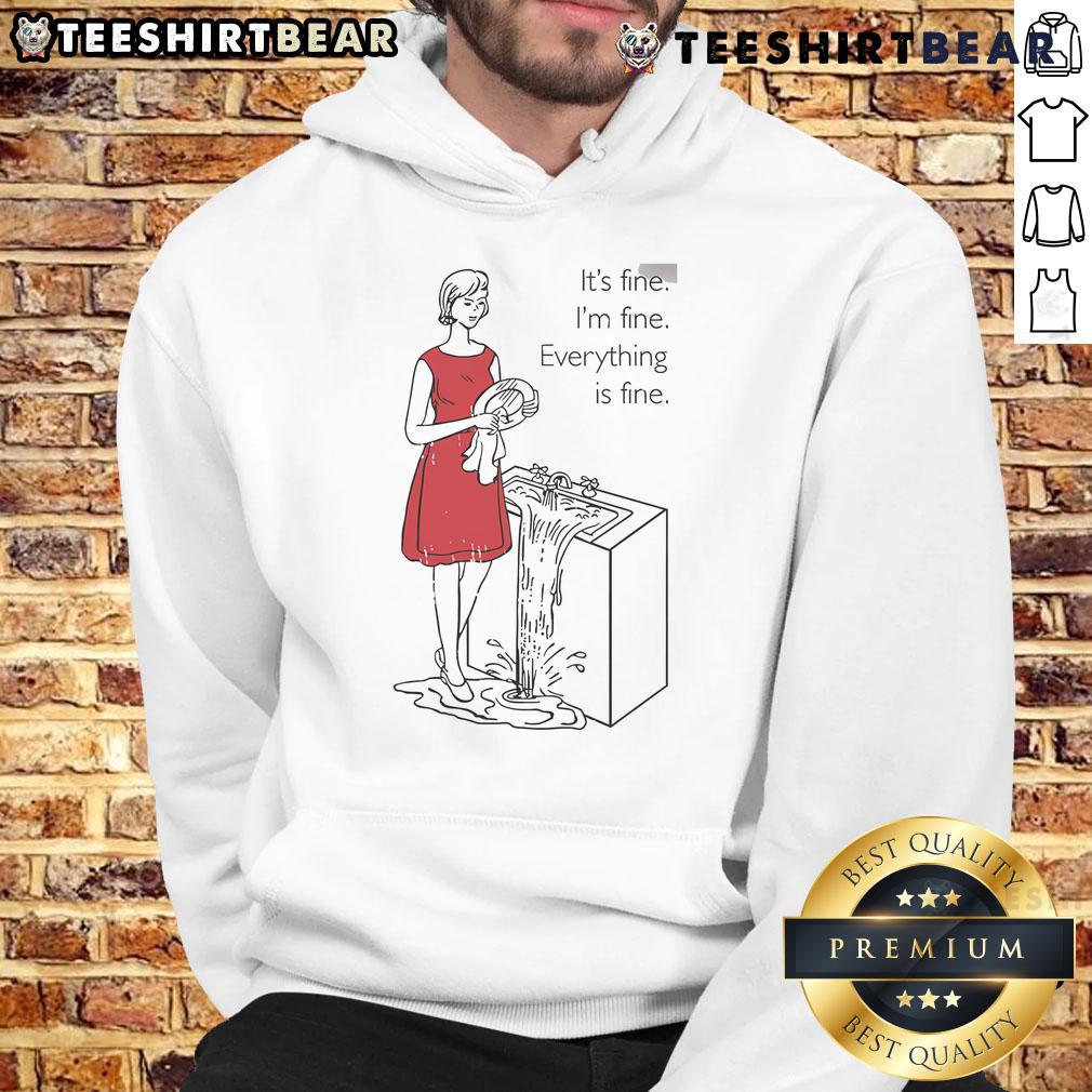 Alt Text: Woman wearing 'Top Cookie Theft Mom Everything Is Fine' hoodie, smiling in a cozy kitchen setting.