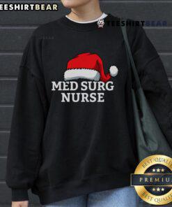 Top Med Surg Nurse wearing a Christmas Santa Hat sweatshirt, showcasing festive spirit in a healthcare setting.