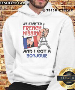 A person wearing a Bonjour hoodie while sharing a playful moment, inspired by the phrase Awesome, we started French kissing.