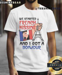 Person wearing a 'Bonjour' T-shirt, smiling after a sweet moment of French kissing, capturing a fun and romantic vibe.