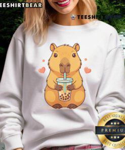 Alt Text: Adorable capybara in a cozy sweatshirt enjoying bubble tea, perfect for capybara and boba tea lovers.
