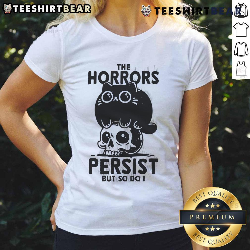 Alt Text: Cute cat graphic on 'The Horror Persist But So Do I' skull ladies tee shirt showcasing a stylish design.