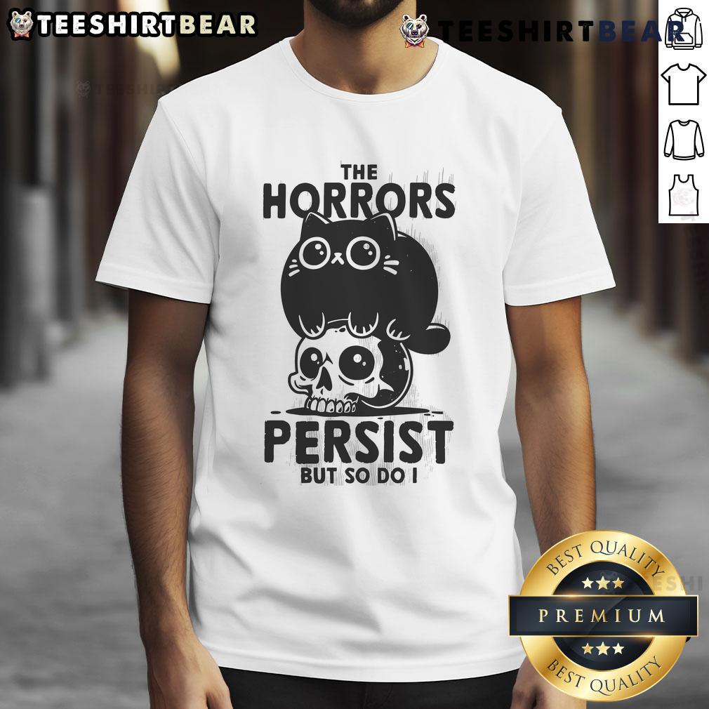 Alt Text: Cute cat graphic on a The Horror Persist But So Do I skull t-shirt, perfect for cat lovers and horror enthusiasts.