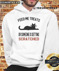 Adorable cat hoodie with 'Feed Me Treats or Someone is Getting Scratched' print, perfect for cat lovers and cozy style.