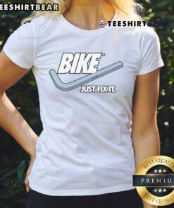 Alt Text: Funny bike-themed Nike logo ladies tee design, featuring humorous text 'Just Fix It' for cycling enthusiasts.