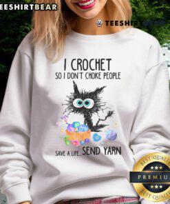 Funny sweatshirt with 'I Crochet So I Don't Choke People' slogan, featuring yarn and a cat graphic, perfect for crafters.