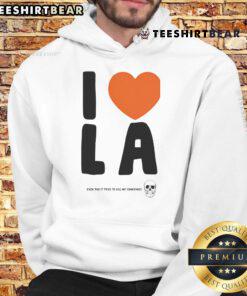 Alt Text: Funny 'I Love LA Even Though It Tries to Kill Me Sometimes' hoodie design featuring vibrant colors and playful text.