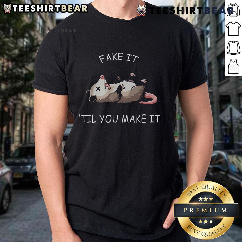 Funny opossum graphic on a 'Fake It Till You Make It' T-shirt for cute animal lovers, showcasing playful design and humor.