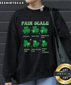 Funny shamrock pain scale graphic on ICU nurse sweatshirt for St. Patrick's Day celebration.