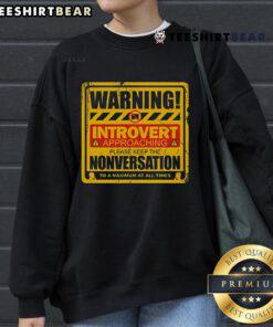 Funny Warning Introvert Approaching sweatshirt featuring humorous text about avoiding small talk and nonversations.