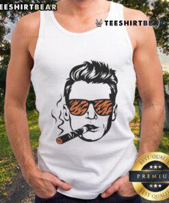 Joe Burrow wearing a stylish Cincinnati Bengals tank top while smoking, showcasing team spirit and casual style.