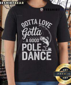 Angler ladies wearing 'Gotta Love A Good Pole Dance' tee, enjoying fishing on a sunny day by the water.