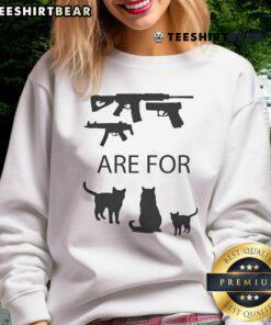Anti-gun cat sweatshirt featuring the phrase 'Good Guns Are For Pussies' in bold text, perfect for animal lovers and activists.