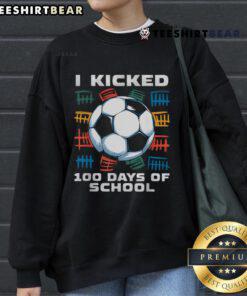 Boy wearing 'Good I Kicked 100 Days of School' sweatshirt, celebrating soccer milestones with a joyful smile.