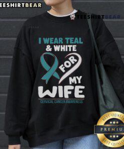 Teal and white sweatshirt promoting cervical cancer awareness, worn with love for my wife, symbolizing support and hope.
