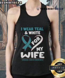 Woman wearing a teal and white tank top for cervical cancer awareness, showing support for her wife.