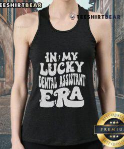 St. Patrick's Day shamrock tank top featuring 'Good In My Lucky Dental Assistant Era' design, perfect for festive celebrations.