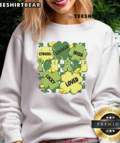 Teacher wearing a green St. Patrick's Day sweatshirt with 'You Are Loved, Worthy Enough, Lucky' text design.