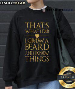 Man wearing a 'Good That's What I Do I Grow A Beard And I Know Things' sweatshirt, showcasing a stylish beard and casual look.