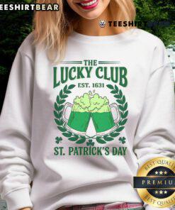 Person wearing a Good The Lucky Club St. Patrick's Day beer drinking sweatshirt, celebrating with festive drinks.