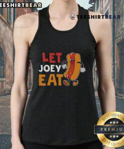 Joey wearing a stylish chestnut tank top, enjoying a meal outdoors in a vibrant setting, showcasing the Nice Let Joey Eat vibe.