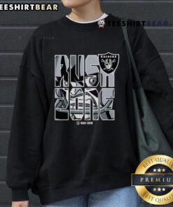 Alt Text: Cartoon-style Las Vegas Raiders football logo on a cozy sweatshirt, perfect for NFL fans and game day attire.
