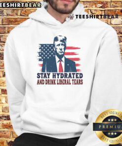Funny hoodie featuring USA flag design with text 'Stay Hydrated By Liberal Tears' for Trump supporters.