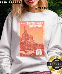 Official Big Thunder Mountain poster sweatshirt featuring vibrant design and iconic theme park imagery.