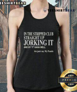 Person wearing a 'Peanuts' tank top at an official club event, showcasing fun and style in a vibrant atmosphere.