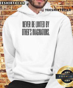 Alt Text: Official Never Be Limited By Others' Imaginations Hoodie in black, featuring bold inspirational text and a modern design.