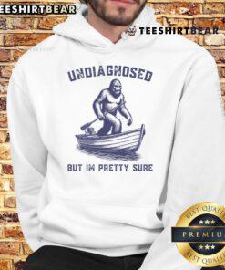 Cozy Official Undiagnosed But I'm Pretty Sure Bigfoot Hoodie in forest setting, perfect for Bigfoot enthusiasts and fans.