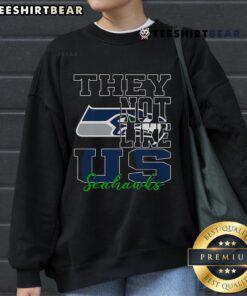 Seattle Seahawks NFL football sweatshirt with 'They Not Like Us' slogan, featuring team colors and logo design.