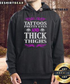 Premium Tattoos Pretty Eyes and Thick Thighs tattoo hoodie featuring bold designs and a stylish fit for tattoo lovers.
