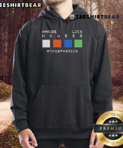 Cozy 'Top Hands Like Houses' atmospheric hoodie displayed on a wooden background, perfect for fans of the band.